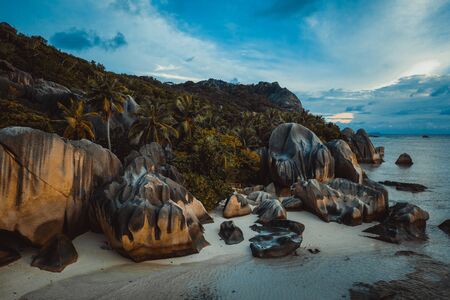 Beautiful beach with white sand on a tropical island in the Seychelles - The famous beach of Anse d'Argent in La Digueの写真素材