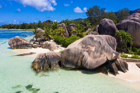 Beautiful beach with white sand on a tropical island in the Seychelles - The famous beach of Anse...