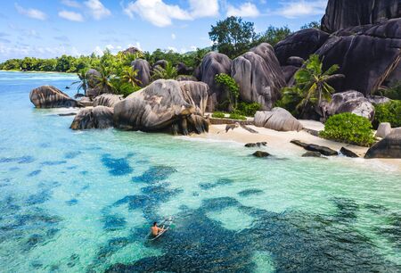 Beautiful beach with white sand on a tropical island in the Seychelles - The famous beach of Anse...