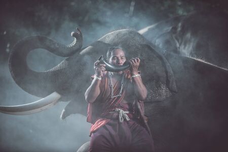 thai shepherds in the jungle with  elephants. Historic lifestyle moments from thailand culture