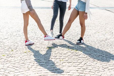 Group of asian girls going out after quarantine during coronavirus period. Young women outdoor with safety masksの写真素材