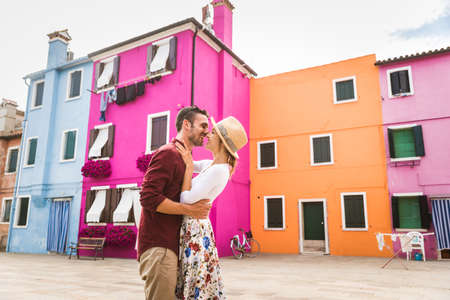 Beatiful young couple having fun while visiting Venice - Tourists travelling in Italy and sightseeing the most relevant landmarks of Venezia - Concepts about lifestyle, travel, tourismの写真素材