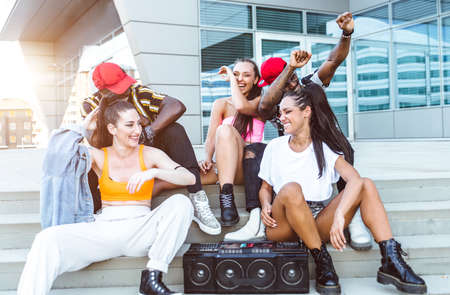 Group of hip hop dancers permorming their dance. Crew making show in an urban place
