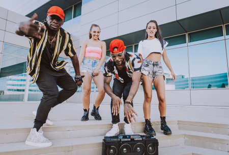 Group of hip hop dancers permorming their dance. Crew making show in an urban placeの写真素材