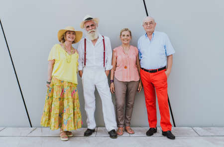 Group of seniors walking and having fun in the cityの写真素材