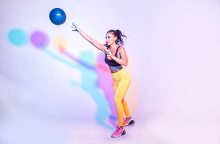 Woman training with the exercizes ball in the gymの写真素材