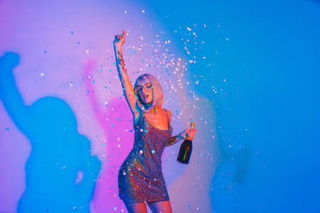 Fashion portrait of beautiful woman on colored backgroundの写真素材