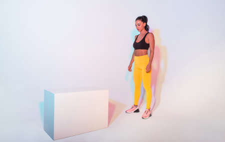 Athletic woman with fitness sportswear traning - Beautiful girl doing fitness in a studio