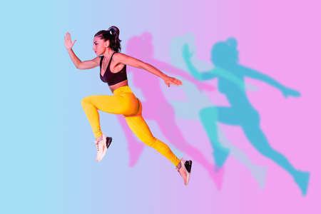 Athletic woman with fitness sportswear traning - Beautiful girl doing fitness in a studioの写真素材