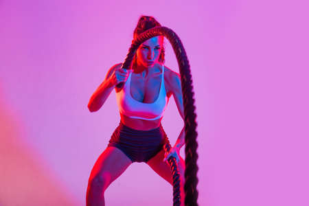 Athletic woman with fitness sportswear traning - Beautiful girl doing fitness in a studio