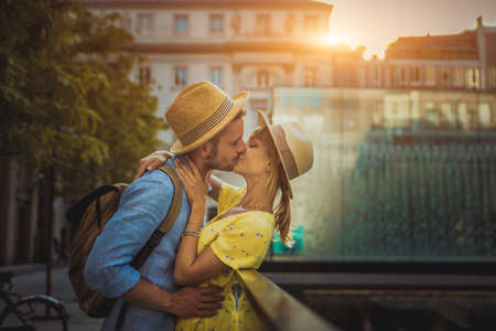 Beautiful couple of lovers sightseeing the city center - Playful tourists visiting a famous european cityの写真素材