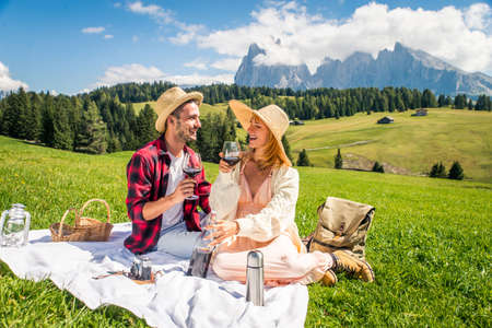 Beautiful young couple traveling in the Dolomites, Italy - Two lovers having a day trip in the natureの写真素材