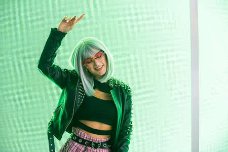 Pretty girl with stylish clothes posing near led lights - Beautiful woman portrait