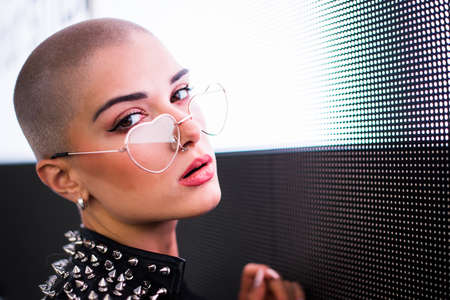 Pretty girl with stylish clothes posing near led lights - Beautiful woman portrait