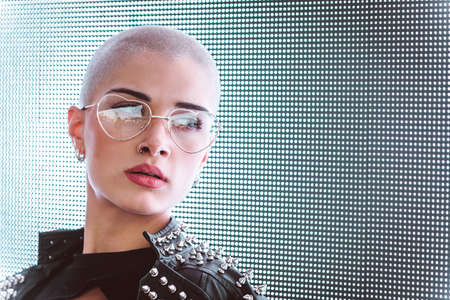 Pretty girl with stylish clothes posing near led lights - Beautiful woman portraitの写真素材