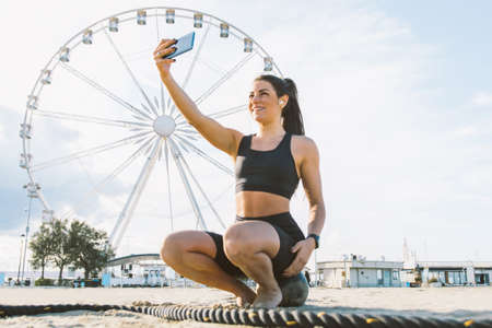 Functional training workout on the beach, fit and athletic woman doing sport outdoors - Concepts...