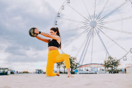 Functional training workout on the beach, fit and athletic woman doing sport outdoors - Concepts...