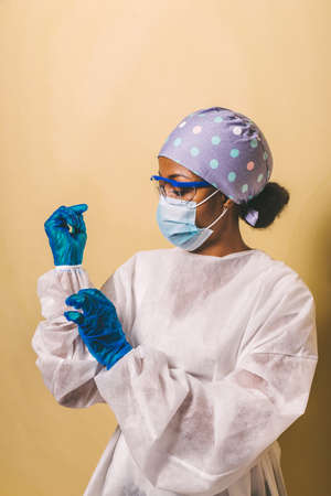 Doctor wearing protection suit and face mask for fighting Covid-19 (Corona virus) - Nurse portrait during coronavirus pandemic quarantine, concepts about healthcare and medicalの写真素材