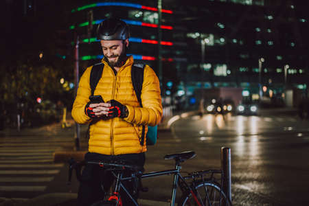 Food delivery service, rider delivering food to clints with bicycle - Concepts about transportation, food delivery and technologyの写真素材