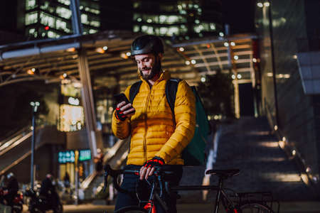 Food delivery service, rider delivering food to clints with bicycle - Concepts about transportation, food delivery and technologyの写真素材