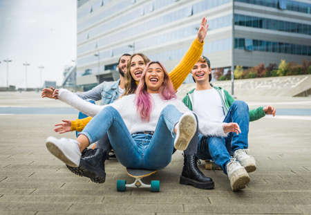 Happy young people meeting outdoors - Group of cheerful teenagers having fun, concepts about teenage, lifestyle and generation zの写真素材