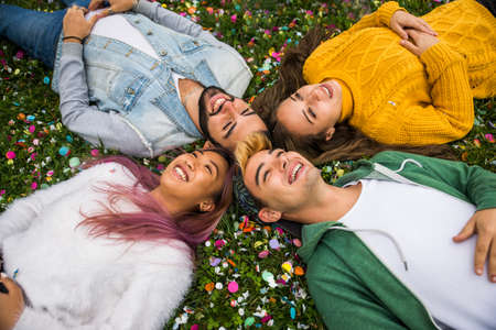 Happy young people meeting outdoors - Group of cheerful teenagers having fun, concepts about...