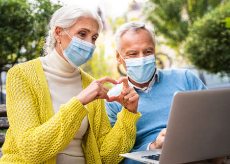 Beautiful senior couple dating outdoors - Mature couple portrait, concepts about elderly and lifestyleの写真素材