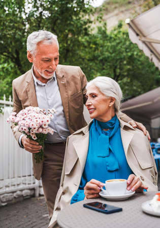 Beautiful senior couple dating outdoors - Mature couple celebrating happy moments in life, concepts about elderly and lifestyleの写真素材