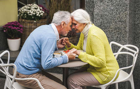 Beautiful senior couple dating outdoors - Mature couple portrait, concepts about elderly and lifestyleの写真素材