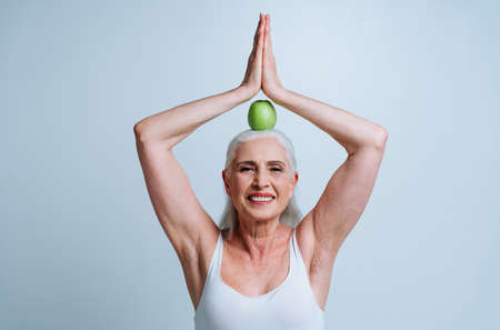 Beautiful senior woman posing on a photoshooting. Concept about lifestyle and seniorityの写真素材