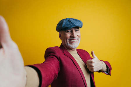 Beautiful senior man posing on a photoshootingの写真素材