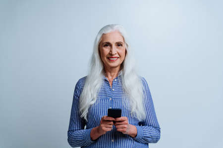 Beautiful senior woman posing on a photoshooting. Concept about lifestyle and seniority
