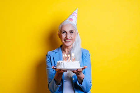 Beautiful senior woman posing on a photoshooting. Concept about lifestyle and seniority