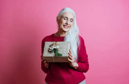 Beautiful senior woman posing on a photoshooting. Concept about lifestyle and seniorityの写真素材