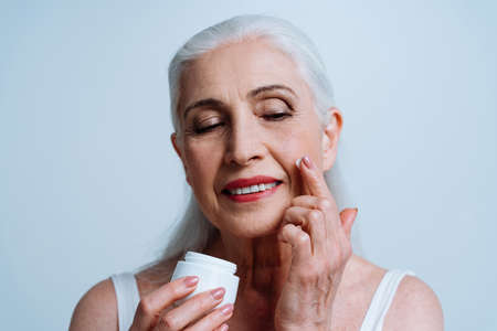 Beautiful senior woman posing on a photoshooting. Concept about lifestyle and seniority