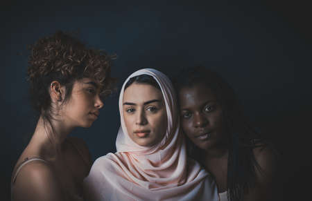 Three girls from different ethnicity posing in the studio for a body positivity photo session
