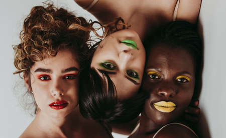 Three girls from different ethnicities posing in the studio for a body positivity photo session
