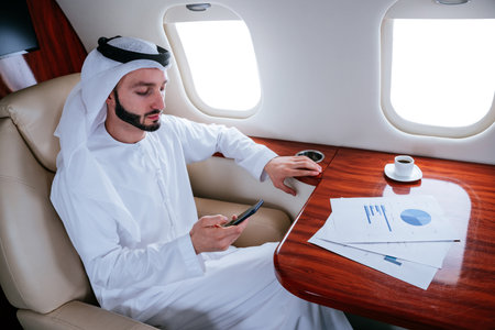 Business man from united arab emirates flying on his private jet to Dubaiの写真素材