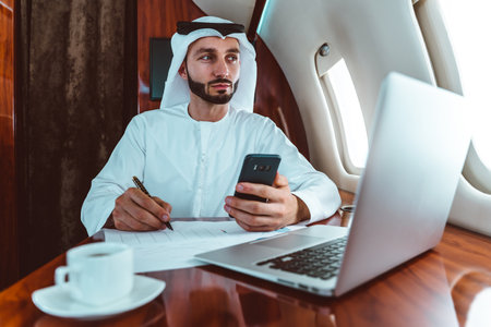 Business man from united arab emirates flying on his private jet to Dubaiの写真素材
