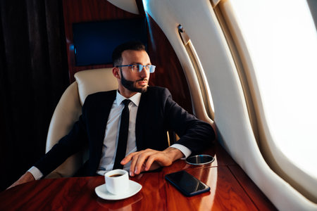 Businessman flying on his private jet. Concept about business, and transportationの写真素材