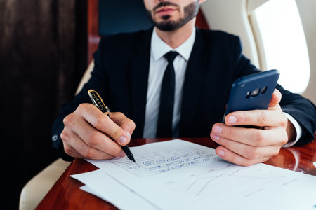 Businessman flying on his private jet. Concept about business, and transportationの写真素材
