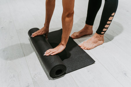 Beautiful girl training in the gym. Russian classic dancer doing stretching and yoga posesの写真素材