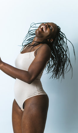 Beautiful woman posing in underwear - Pretty girl portrait, concepts about multicultural people, inclusive society and body positivityの写真素材