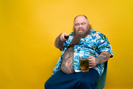 Funny and hilarious fat man hungry for unhealthy foodの写真素材