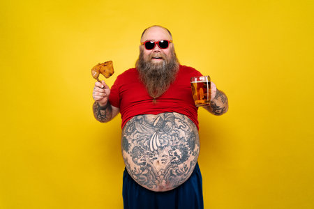 Funny and hilarious fat man hungry for unhealthy foodの写真素材