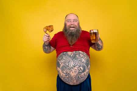 Funny and hilarious fat man hungry for unhealthy foodの写真素材