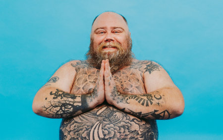 Funny fat man doing yoga meditation, funny and ironic characterの写真素材