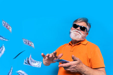 Eccentric senior man with funny expression portrait on background - Active and youthful old maleの写真素材