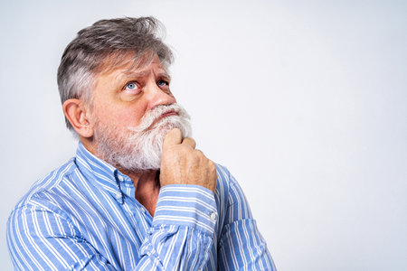 Eccentric senior man with funny expression portrait on background - Active and youthful old maleの写真素材
