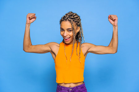 Beautiful afroamerican woman with pigtails portrait on colored background